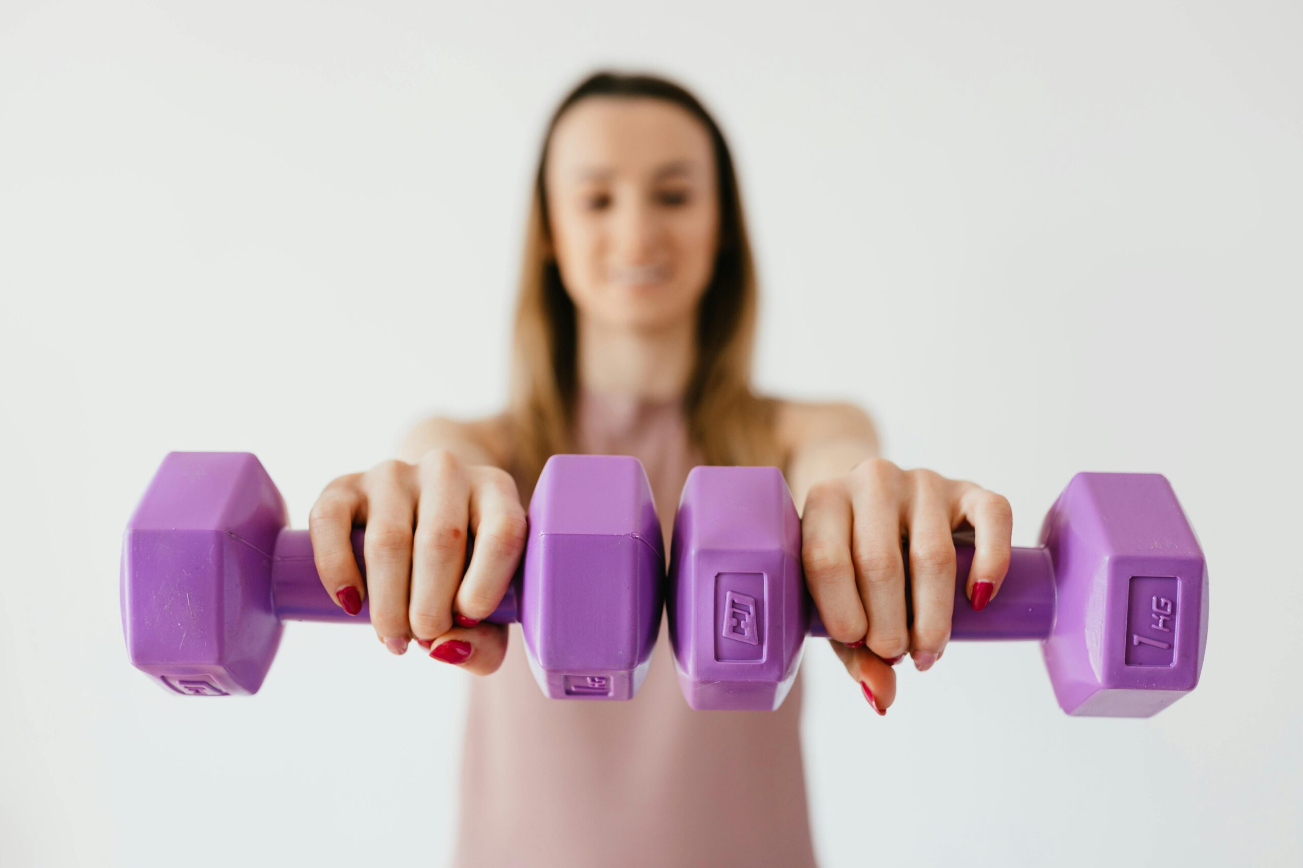 Woman lifting dumbbells